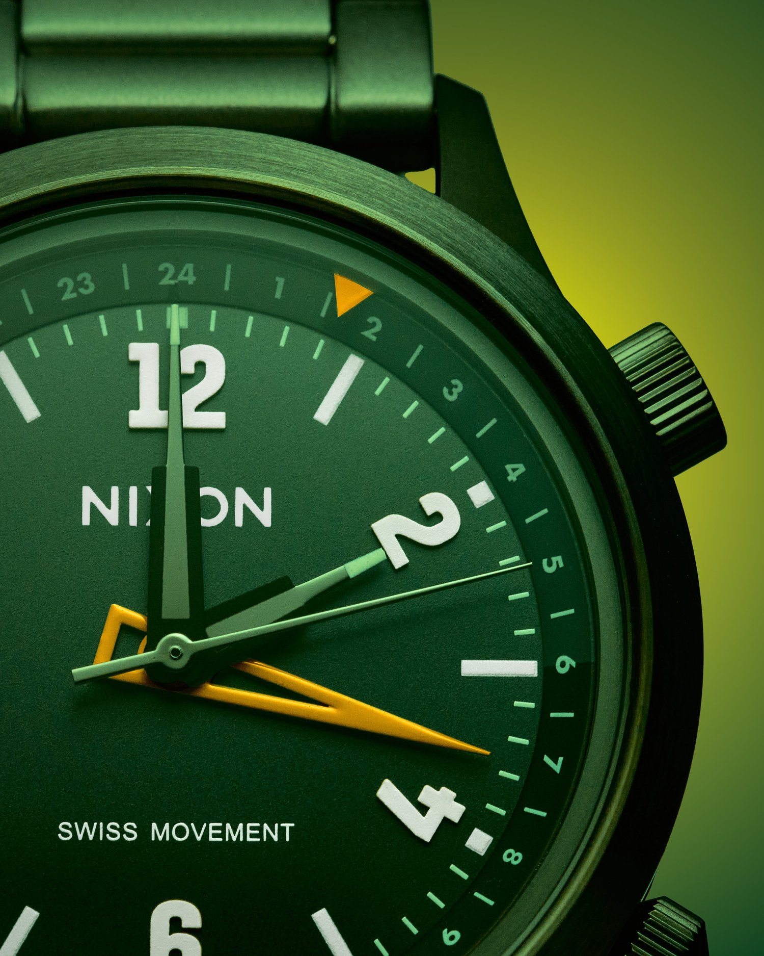 Reflective product photography of a Nixon watch showing controlled highlights on metal and glass