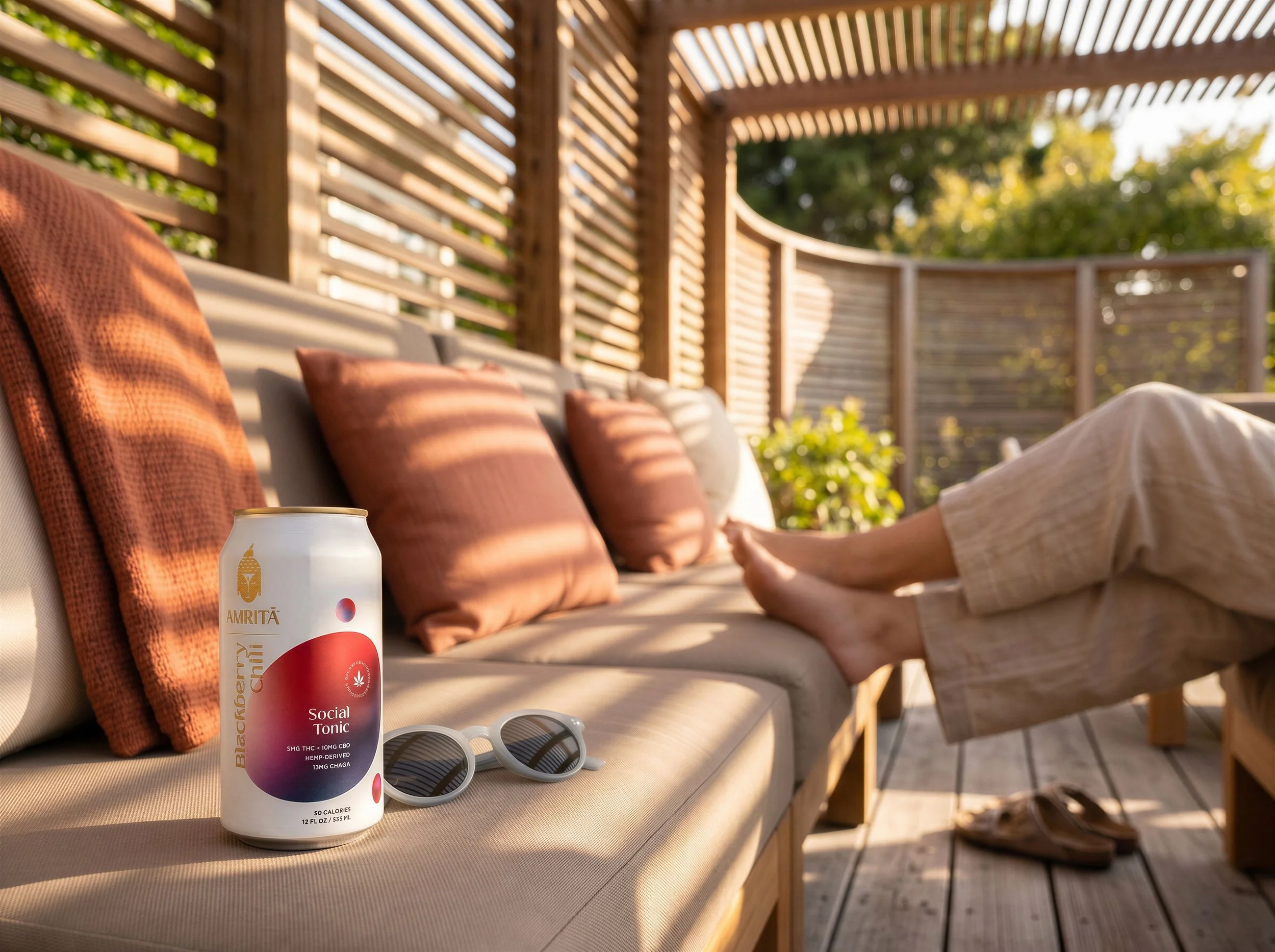 outdoor_patio_with_cushioned_seating_and_drink.jpeg