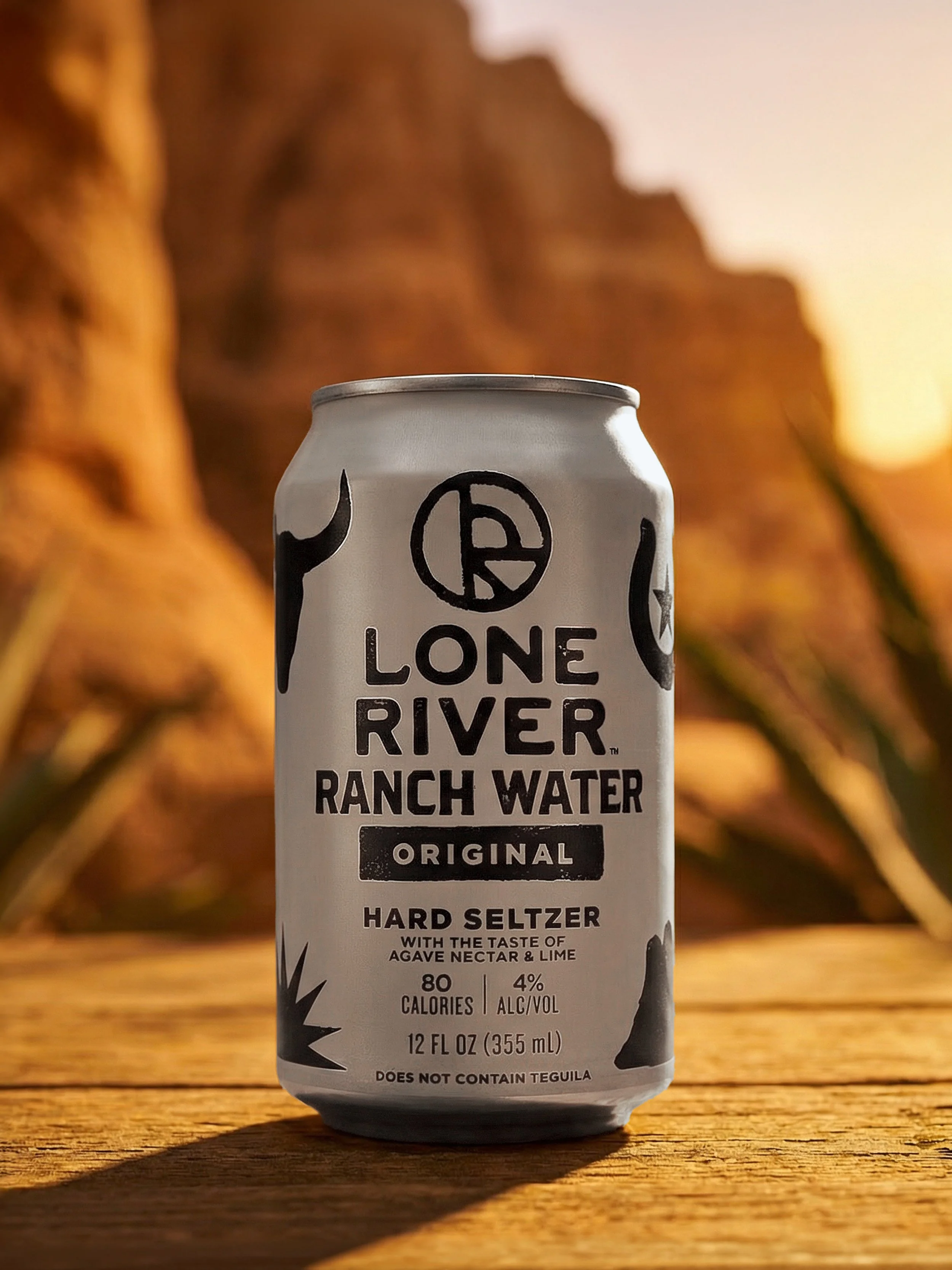 Lone River Ranch Water Hard Seltzer Can – Texas Desert Outdoor Product Photography with Warm Sunset Background
