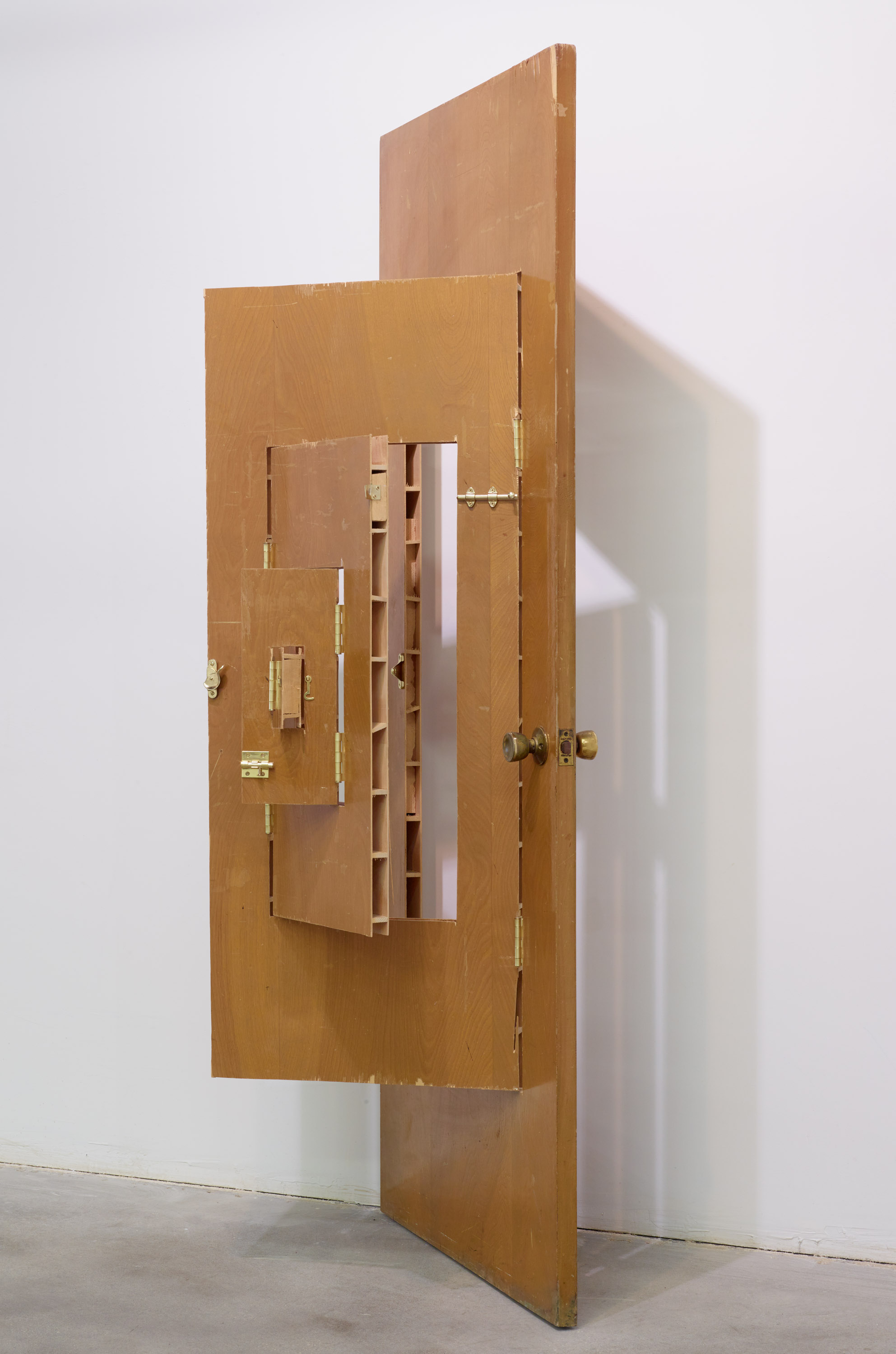 Joshua Callaghan , Door #1 , 2010. Modi ed door, wood, hardware, 79.5 x 31.75 x 6 inches folded. 