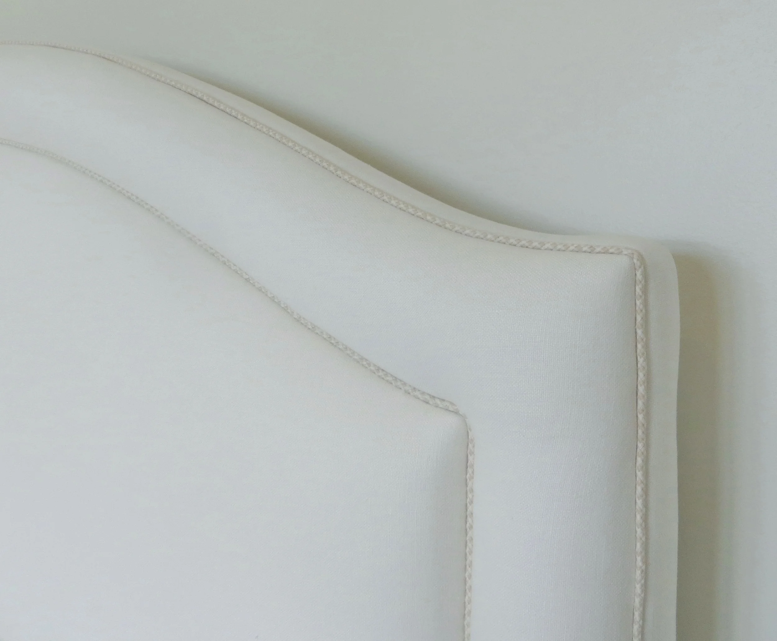 custom upholstered head board with accent cording