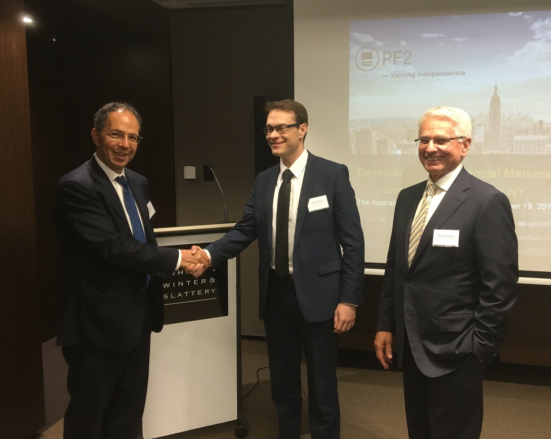  Tim Castle greets Gene Phillips, with fellow co-chair & JWS Partner Richard Gelski 