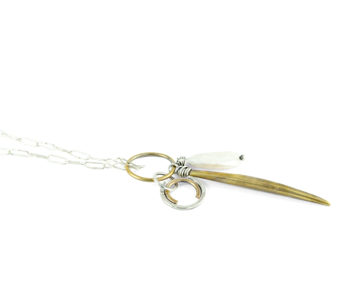 Close Up of Long Charm Necklace © Margaret Ellis
