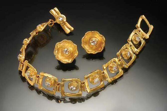 A bracelet and earrings suite by Margaret Ellis circa 1990s