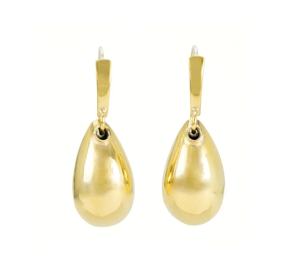 A fresh variation on a collector favorite, our Tear Drop Swing Drop Earring combines the elegance of our classic swing drops with our bold tear drop. Handcrafted by our talented artisans, this hammered, hollow teardrop shape is suspended on a sleek t