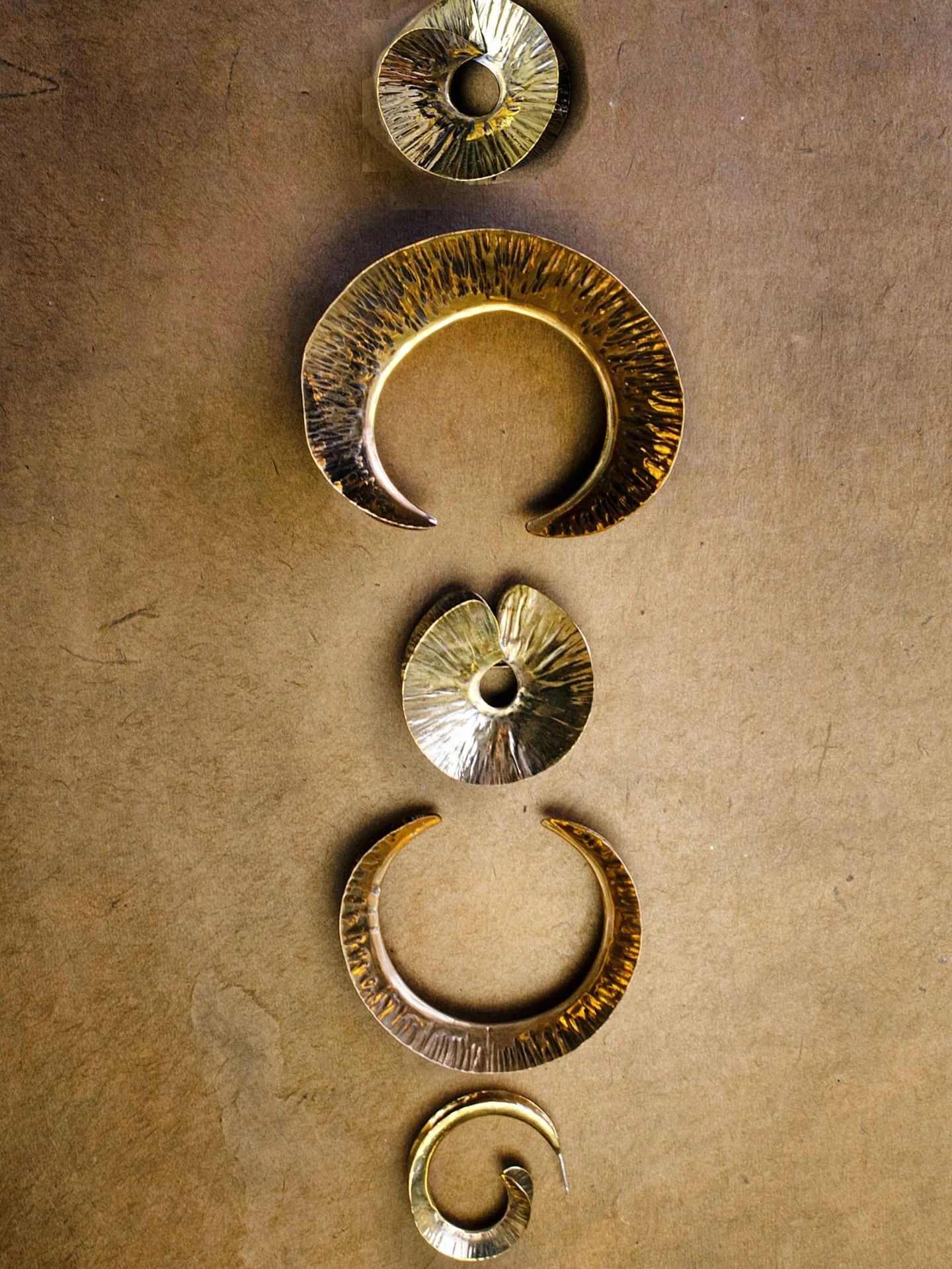 Strong. Sculptural. Unmistakably ME.
Every piece of ME is shaped by hand using traditional metalsmith techniques. Our Fall STRATA Collection involves a lot of foldforming&mdash;metal is folded, repeatedly forged and annealed, and unfolded to reveal a
