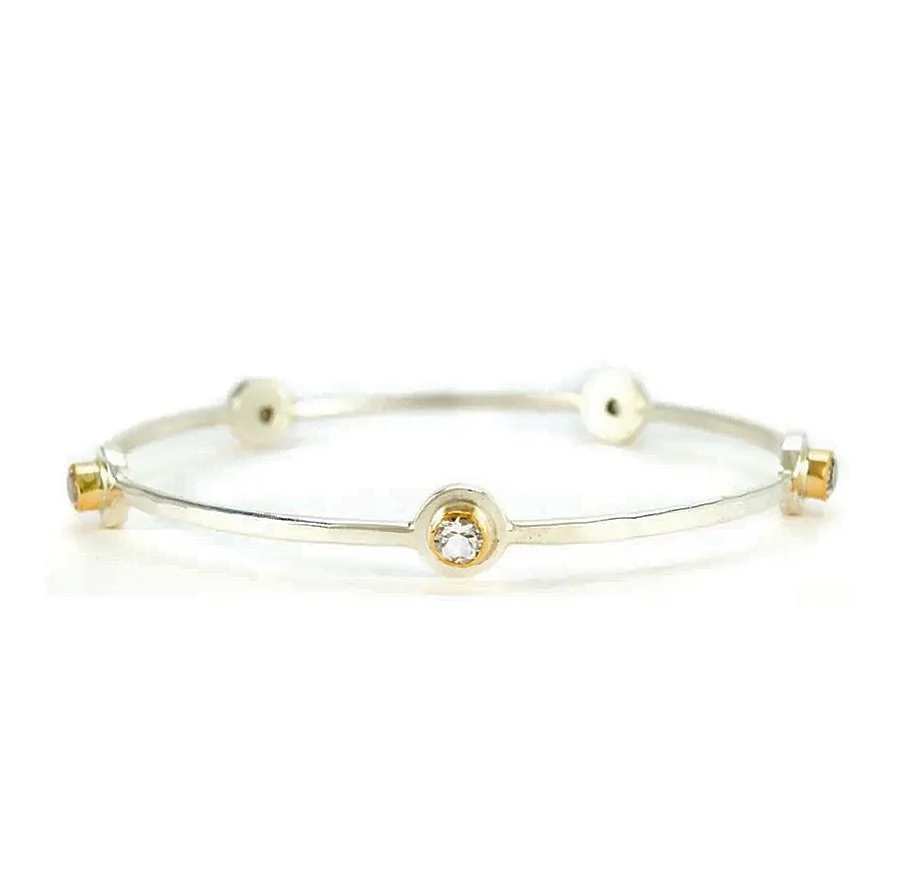 One of our classic Bright Silver &amp; 14k Gold Filled Medium Five Stone Bangles &mdash; set with white topaz &mdash; made and ready to wrap for your Valentine. Or for you. 💔💔

Come see ME this week.