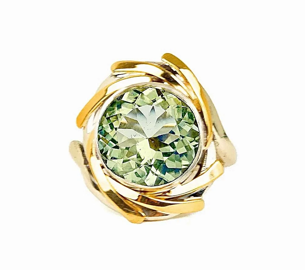 A stone as singular as its story. ✨
Light green tourmaline, hand-selected for its multi-faceted character and set in sterling silver kissed with 18K gold&mdash;handmade in Nashville for the one it was made for.

Could this be yours? 🤍