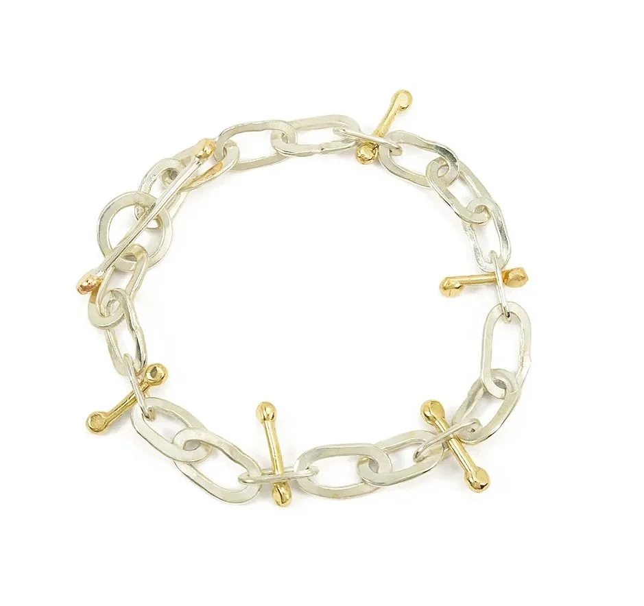 Who doesn&rsquo;t love a surprise?

A mixed metal toggle bracelet with unexpected sculptural spikes, subtle movement, and an effortless sense of balance. Tactile and easy&mdash;worn daily, without a second thought, until someone stops to complement y