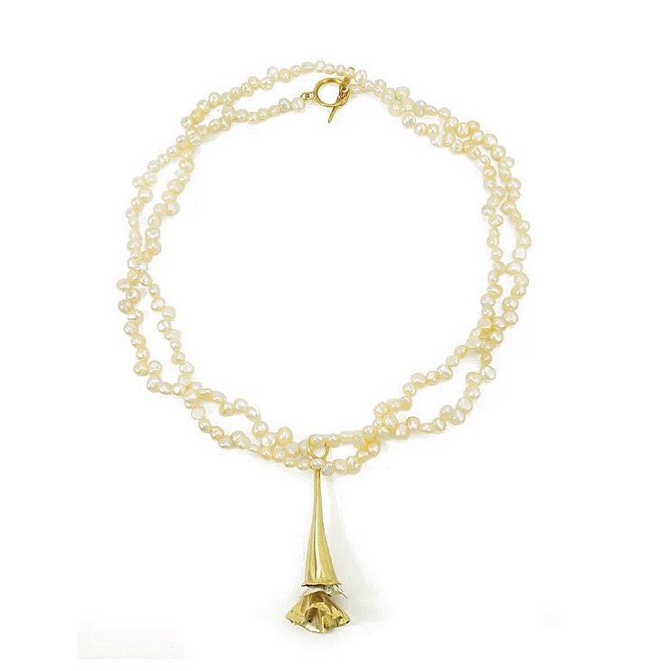 Did summer sneak up on you too? ☀️

Suddenly it&rsquo;s dinner on the patio, staying out later than planned, and finding reasons to linger a little longer.

This strand of tiny pearls with a detachable oversized Calla charm makes even the most ordina