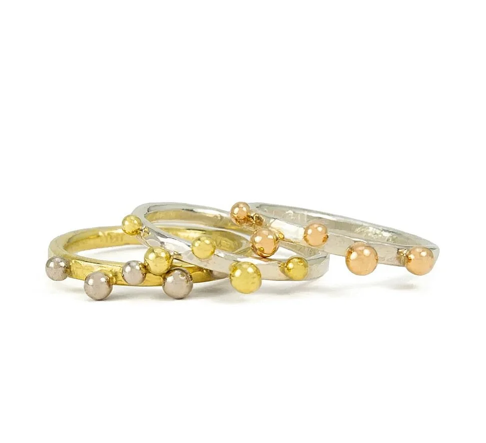 One, two, or three?

Our Dots Bands are designed to be mixed, matched, and stacked your way. Choose from sterling silver with 18K pink gold, sterling silver with 18K yellow gold, or 18K yellow gold with palladium white gold.

Made by hand in Nashvill