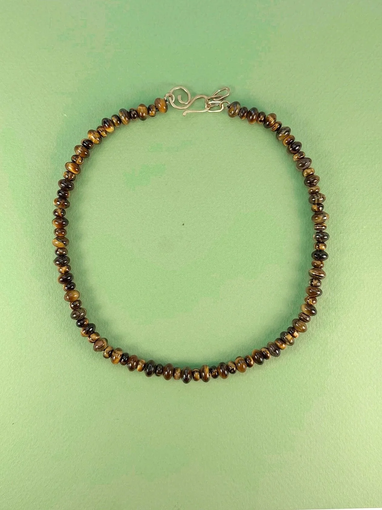Jewelry made to be worn, lived in and remembered. This one-of-a-kind Tiger Eye necklace is handcrafted in Nashville using hand-selected stones from the ME archives. A meeting of story and stone&mdash;yours and ours, aligned. ❤️❤️