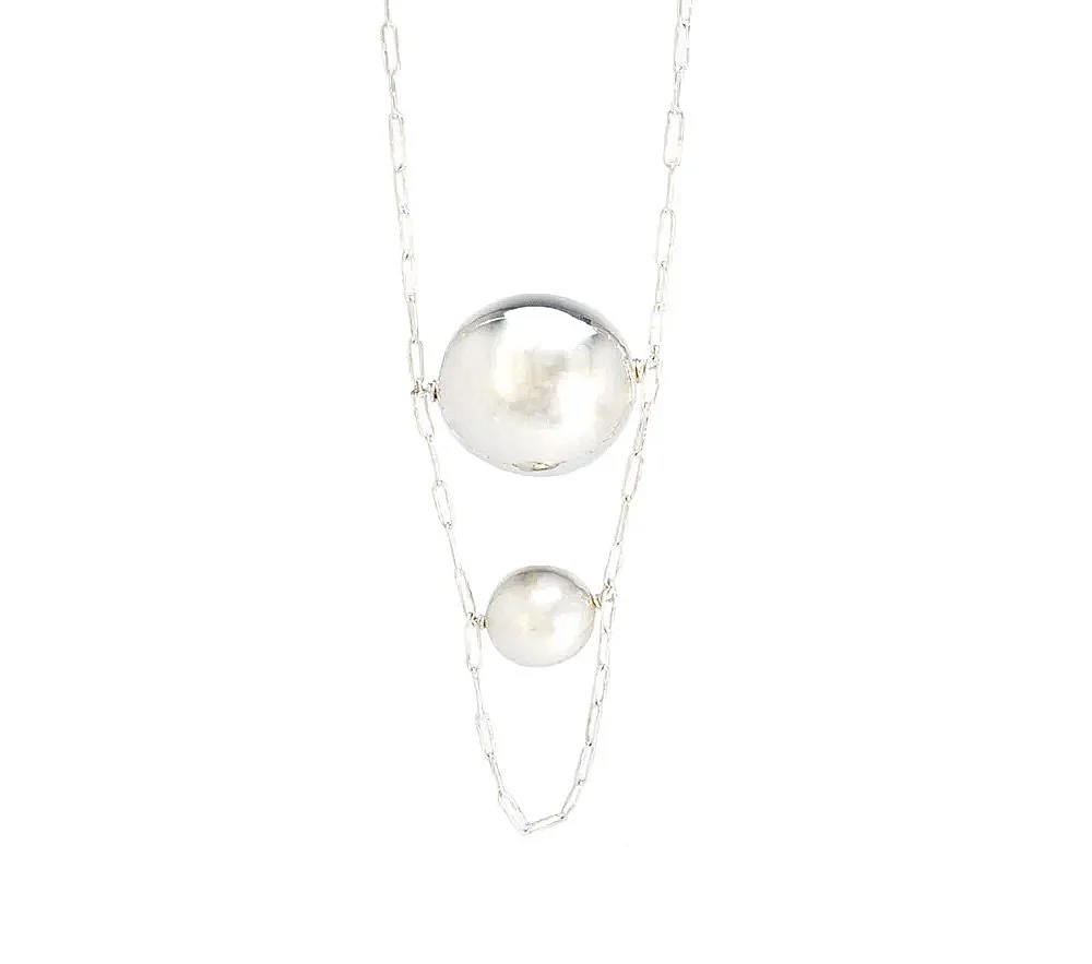 A little bit of magic in the making. ✨

Introduced in the summer of 2017, the Ball Chain Necklace quickly became an ME classic. I personally wear this one on repeat.

Two hollow sterling silver balls appear to float on a delicate chain &mdash; a litt
