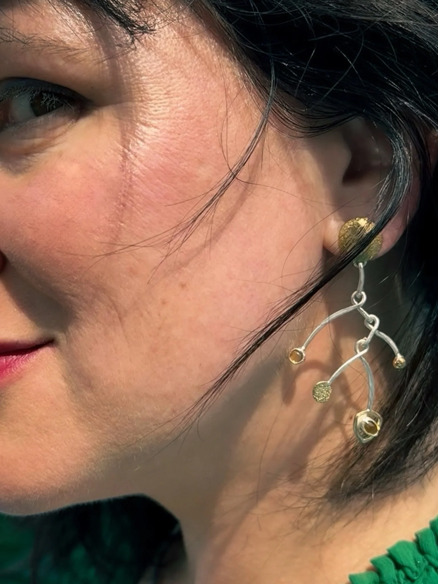 Playful, graceful, and full of little surprises. ✨

Petal Arc&rsquo;s delicate mobile form, swinging discs and bezel-set citrines move with you, catching the light with every turn.

Wearable art. A little color, a little whimsy, and a fresh take on f
