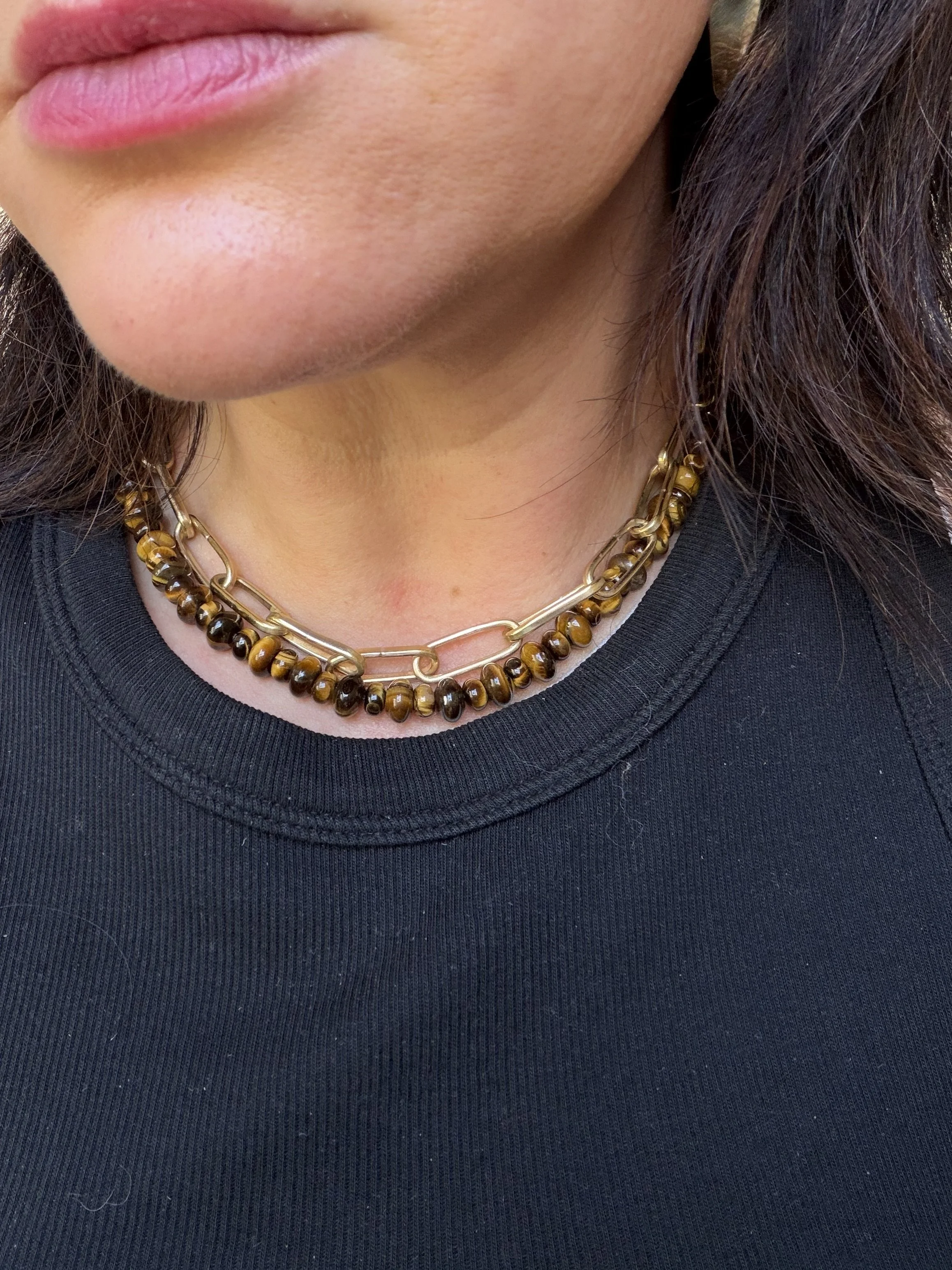 Tiger Eye Stone Bead Necklace worn with gold chain on woman