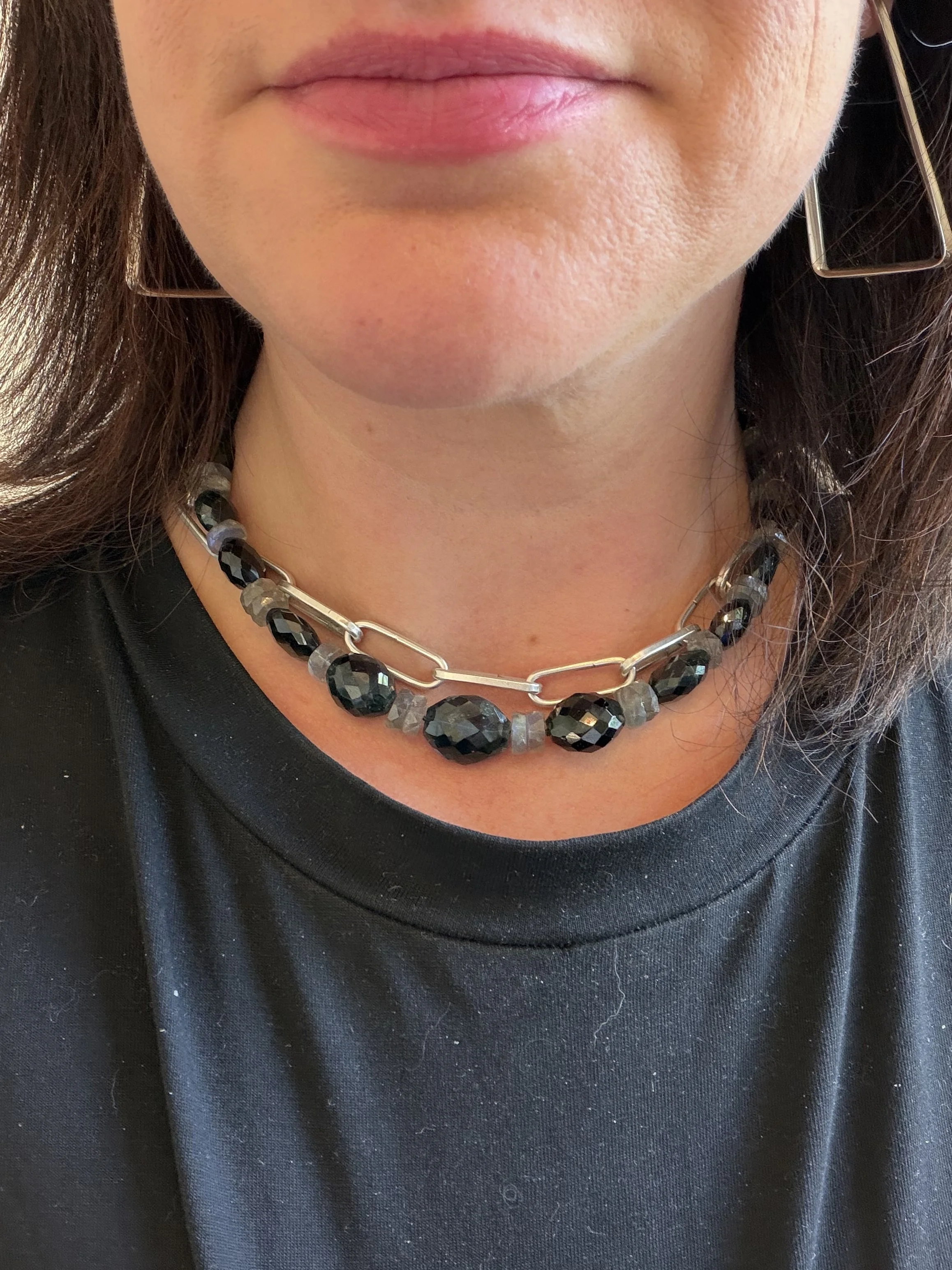 green tourmaline and labradorite stone bead necklace on a woman