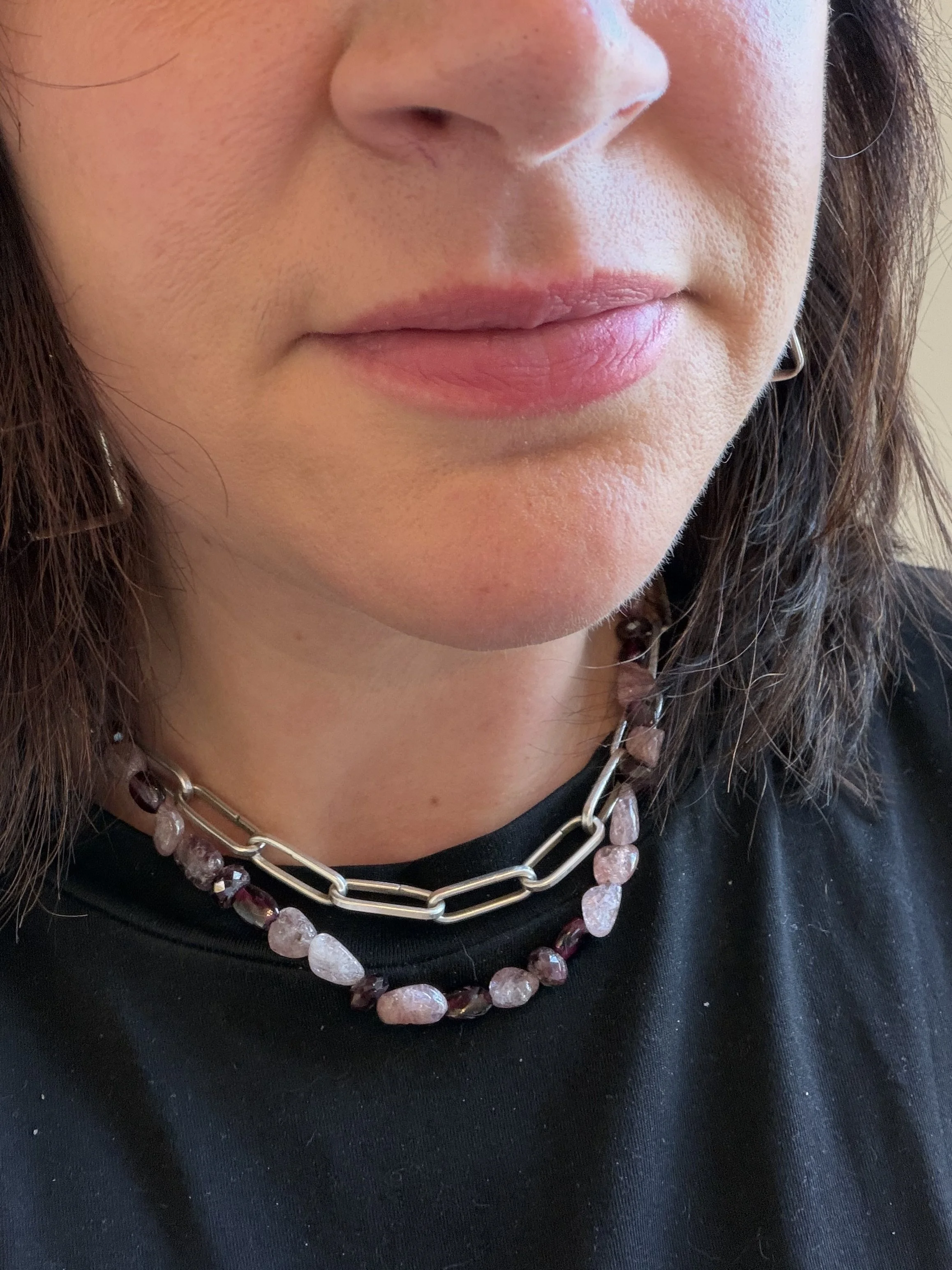 pink spinel and rhodolite garnet stone bead necklace on a woman