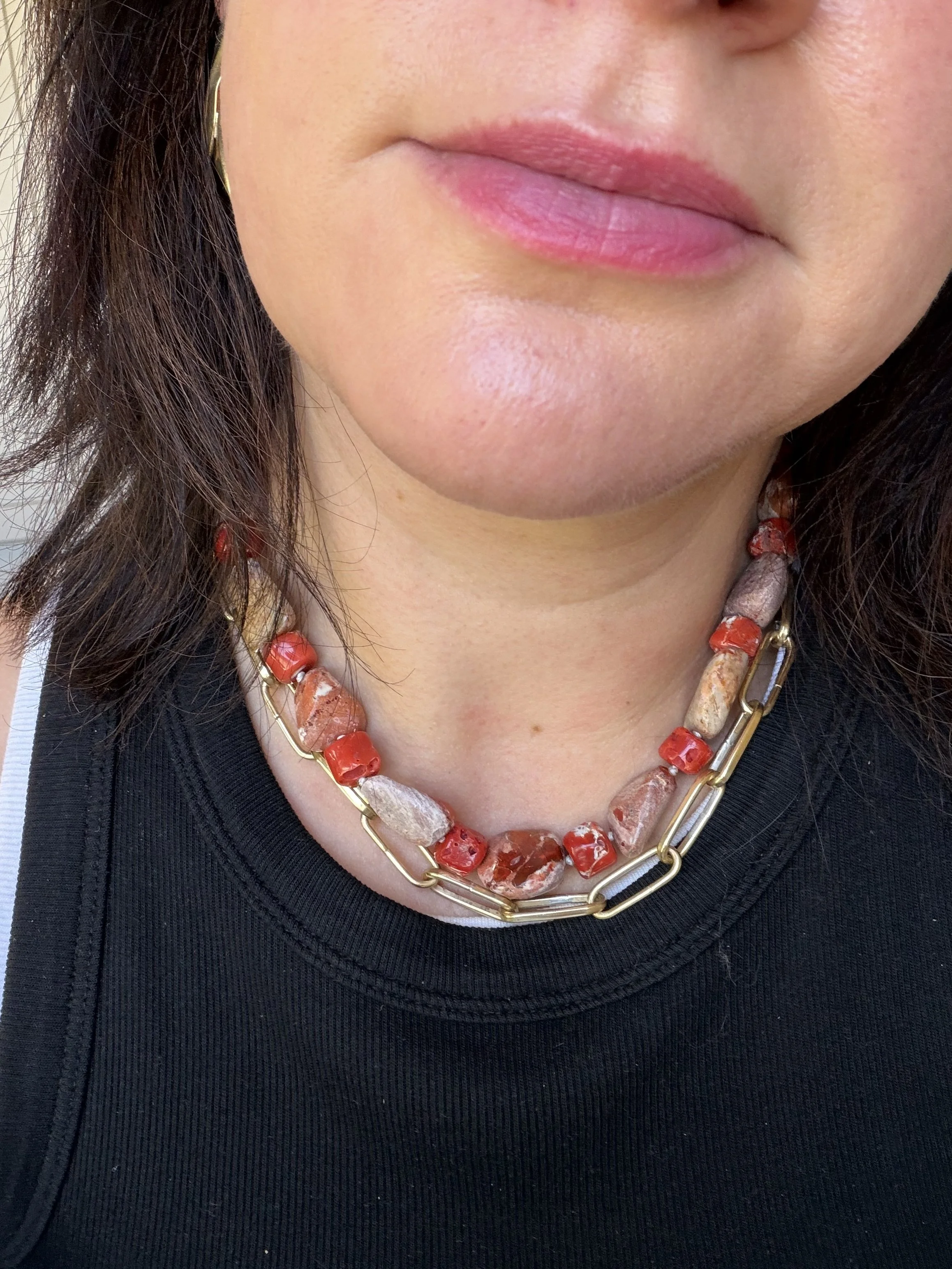 Mexican opals and raw red coral stone bead necklace worn on woman