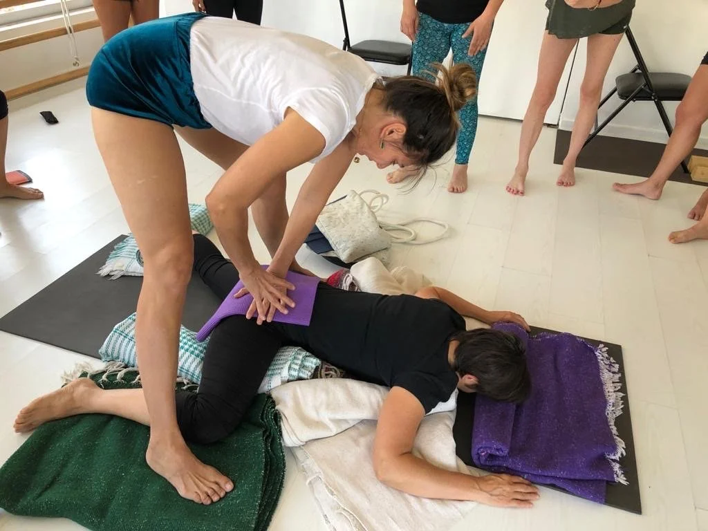 Senior Iyengar Yoga Teacher Lara Warren creating a therapeutic setup for back pain.