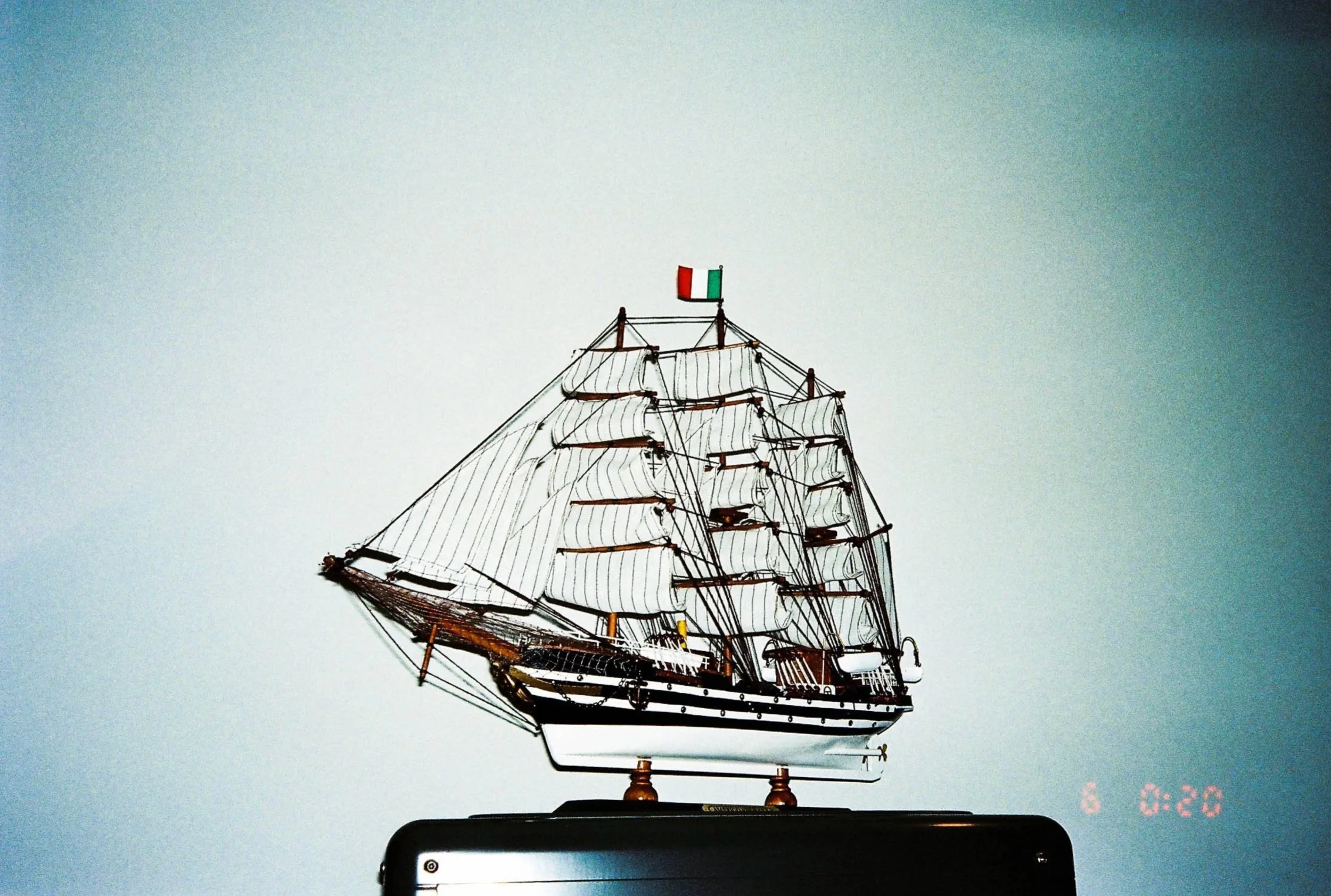 Model ship on a pedestal against a pale blue background — Shanghai fashion and portrait photography | Victor Marvillet photographer