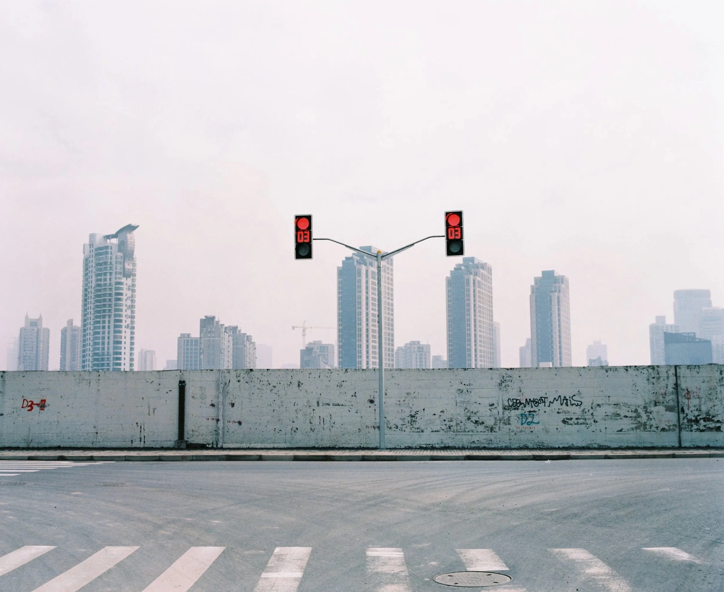 Shanghai skyline seen across an empty road — Shanghai fashion and portrait photography | Victor Marvillet photographer