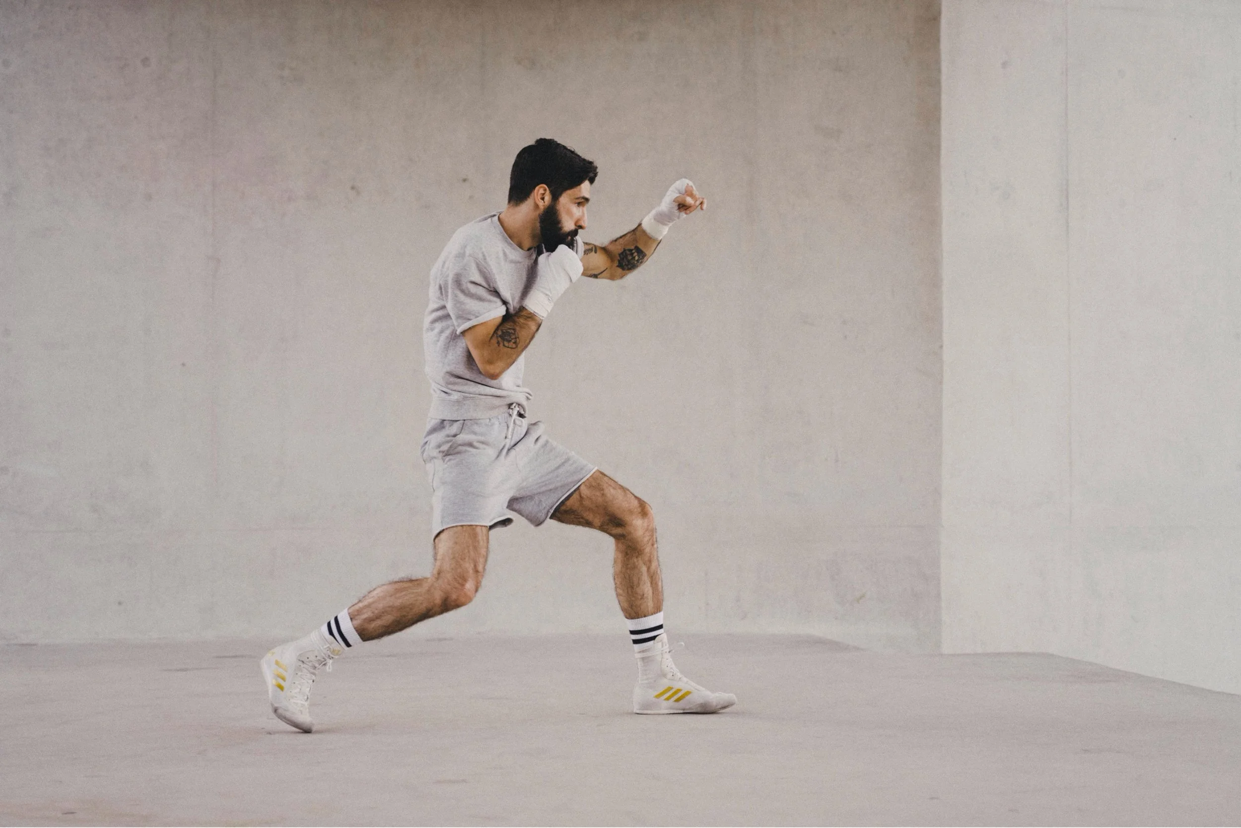 Boxer shadowboxing against a concrete wall — Shanghai fashion and portrait photography | Victor Marvillet photographer