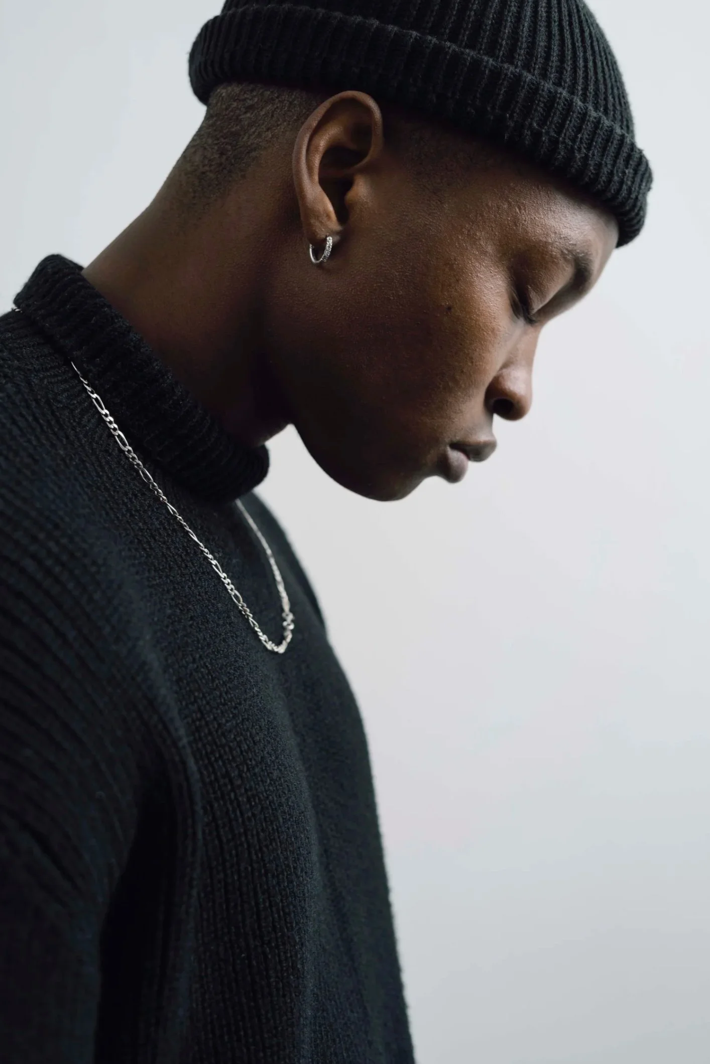 Profile portrait of a man in a black beanie and chain — Shanghai fashion and portrait photography | Victor Marvillet photographer