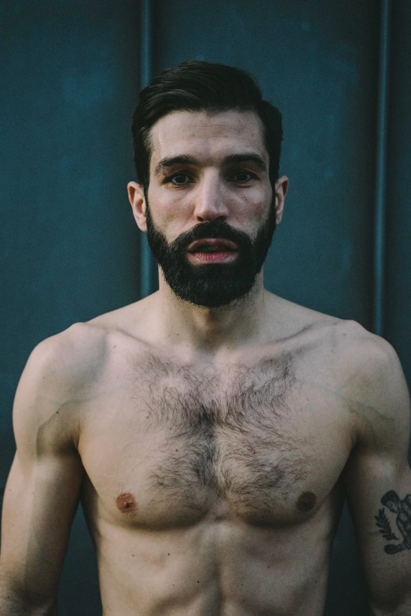 Shirtless bearded man against a dark wall — Shanghai fashion and portrait photography | Victor Marvillet photographer