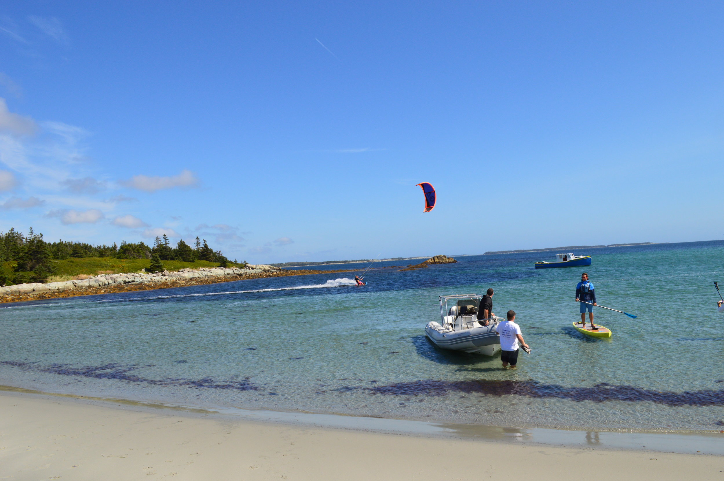 Kitesurfer Mark Moore, Jan LaPierre of A for Adventure, Joel and Travis helping to ferry everyone to shore from Brian Murphy's Boat!