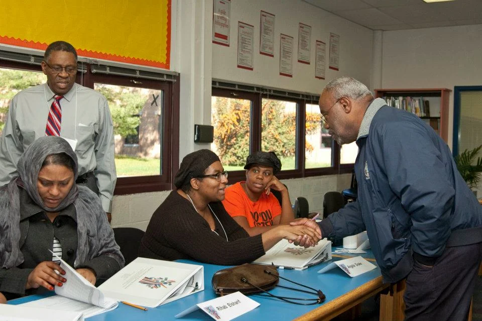 Angela Drake shakes the hand of Mayor Bill Euille. Mayor Euille helped Angela convince the King Street Walgreen's to donate 7000 thermometers to every public elementary school in Alexandria. Photo courtesy of PLTI
