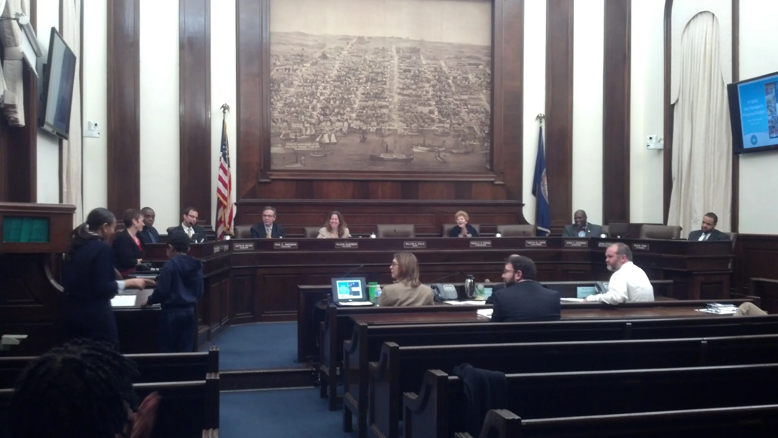 Mariam Fikre and her son, Nathanael, addressing the Alexandria City Council regarding their concerns on the public budget. Photo courtesy of PLTI.