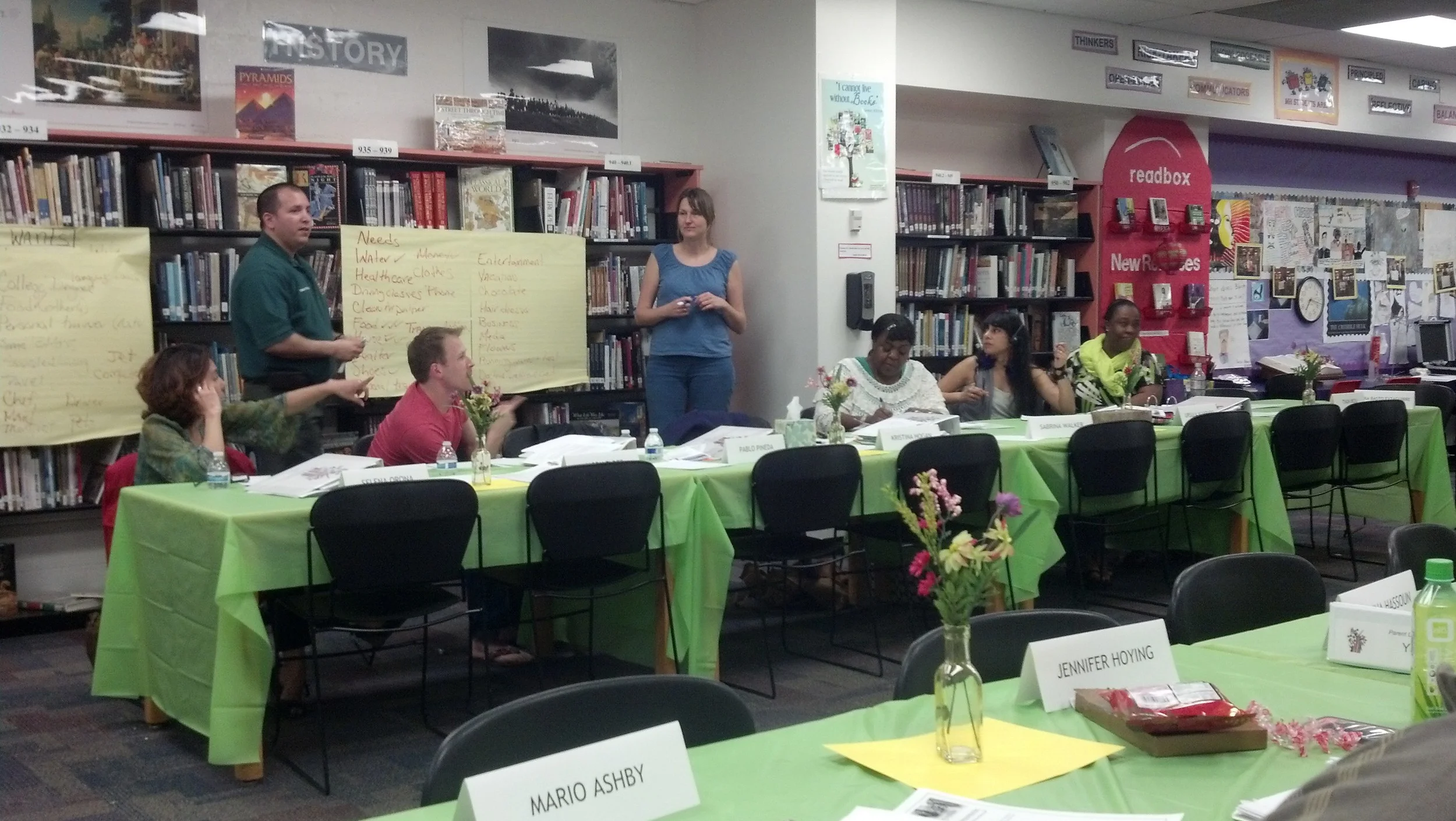 Pablo Pineda and Kristina Hogan lead their classmates in an interactive exercise designed to teach them more about how government allocate budget funding. Photo courtesy of PLTI