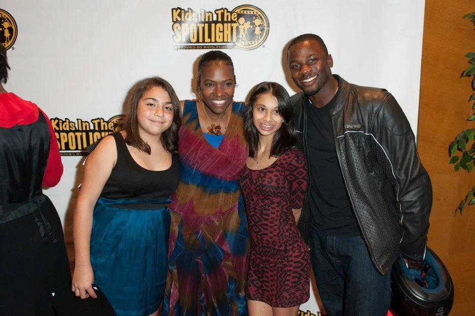 Founder Tige Charity with KITS participants and actor Derek Luke