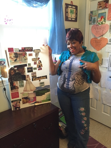 A Community of Hope housing client shows off her space/ Photo courtesy of Community of Hope
