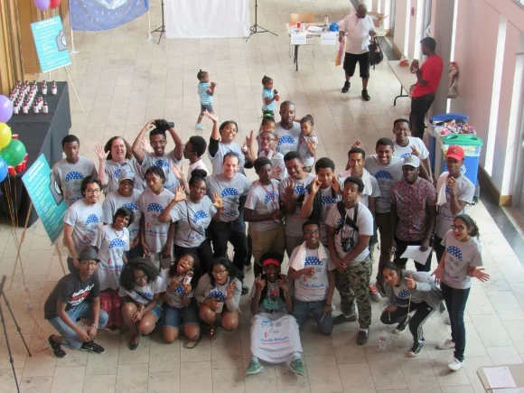 Volunteers smile for the camera