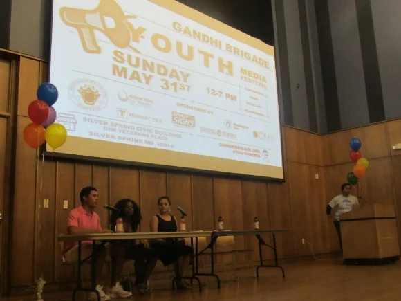 Teens participate in a panel discussion