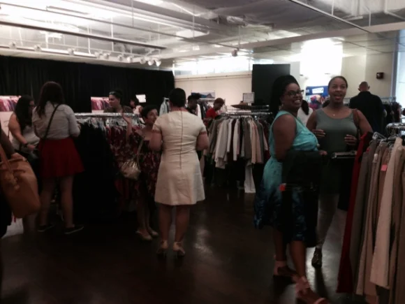Guests browse the racks at the Goodwill Edited Summer Trunk Show, co-hosted by the Young Professionals Council.