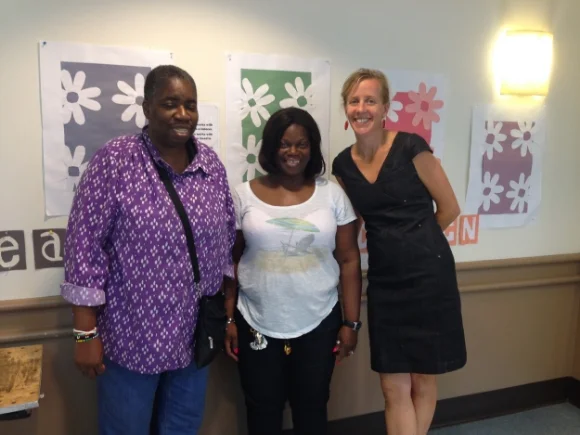 Sharon Hart, community organizer; Gisele C.; Stuart Allen, chief development officer 