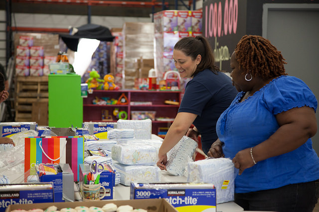 DC Diaper Bank executive director Corinne Cannon bundles diapers with a volunteer./ Photo courtesy of DC Diaper Bank