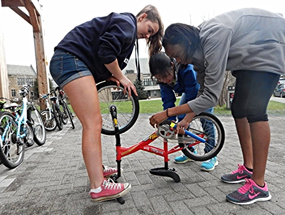 Students at The Friends School in Baltimore work on a bike./ Photo courtesy of Bikes for the World