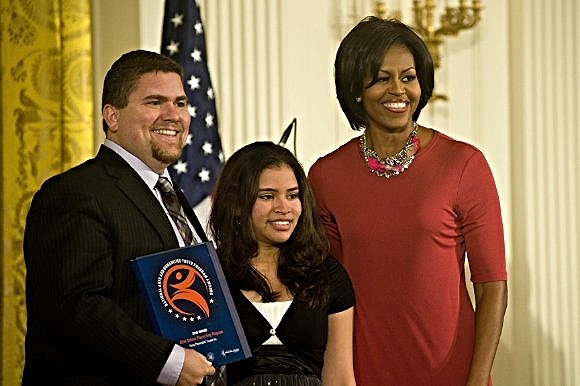 YPT student Mariana with then-CEO David Andrew Snider and First Lady Michelle Obama, 2010/Photo Source: Young Playwrights Theater
