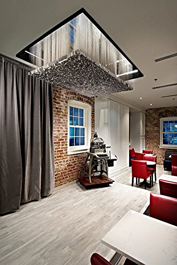 Thousands of dog tags comprise a chandelier at Dog Tag Bakery