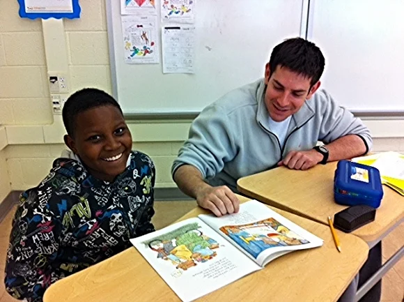 Tutor Dave works with student Emmanuel./Photo courtesy of Reading Partners