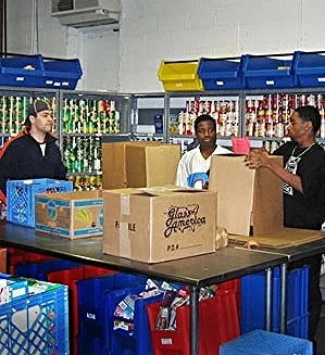 The volunteers at Manna Food Center pack boxes to distribute more than 16,000 pounds of food each day, according to Manna's 2014 annual report .
