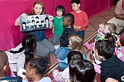 A Goodwill Ambassador reads a story about Japanese traditions./ Photo by the National Cherry Blossom Festival, Inc