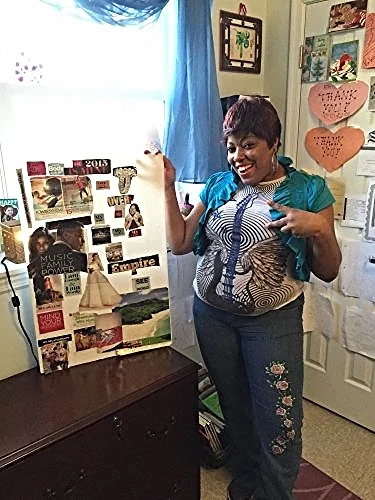 A Community of Hope housing client shows off her space/Photo courtesy of Community of Hope