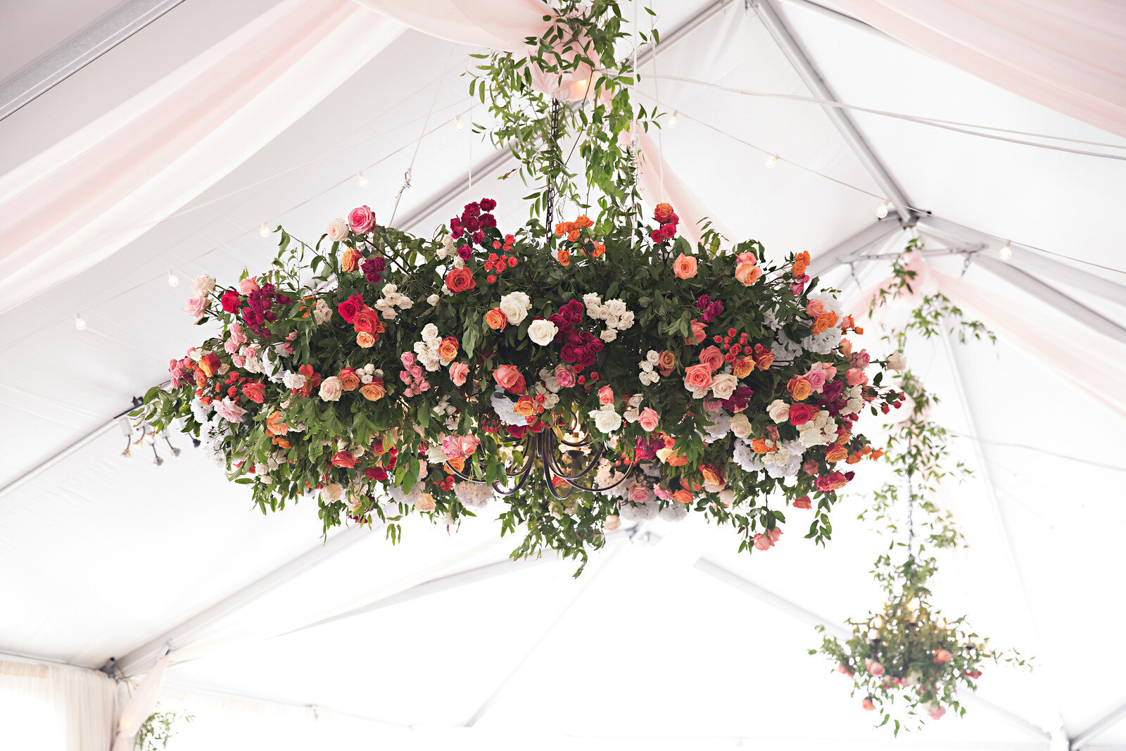 Ceiling flower installation wedding reception 