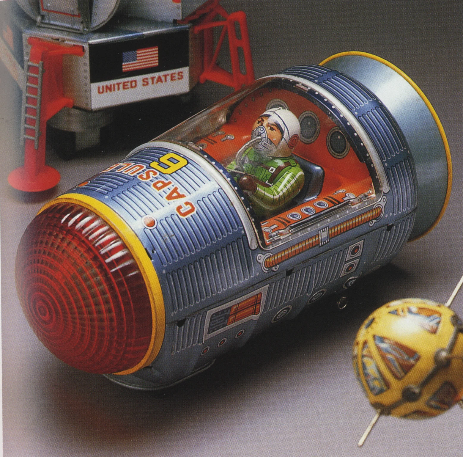 Moon Explorer, tin toy by Yonezawa, 1960s; and Capsule 6, tin toy by Masudaya, 1960s; both photographs by Yukio Shimizu, reproduced in Robots, Spaceships and Other Tin Toys, Taschen, 2006 (first edition 1996)