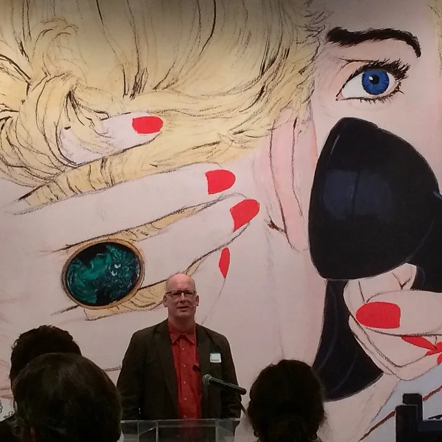 Your Truly, speaking in front of a giant reproduction of a Mac Conner illustration. If you go to the show, which I urge you to, here's some treasure hunt fun: go find this actual illustration and look at that ring: what's surprising about it? Photograph by Deep Dutta . (Thanks, Deep!) 