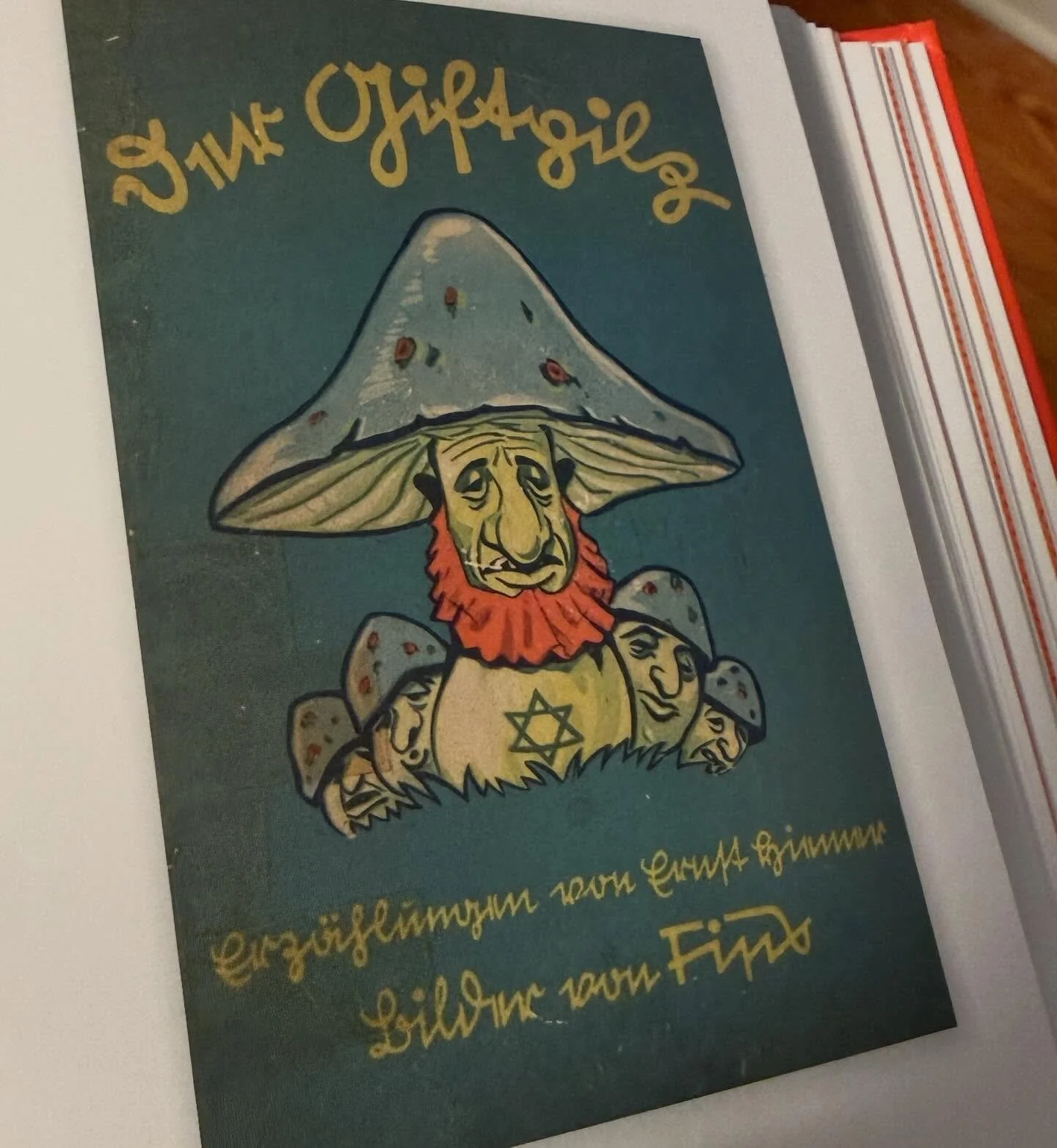 Last in this set, an illustrated cover for Der Giftpilz (The Poisonous Mushroom) by Ernst Hiemer, published by Jules Streicher in 1938. A book for children devoted to assiduous service of the Third Reich, arguing that Jews are deceptively wicked, let